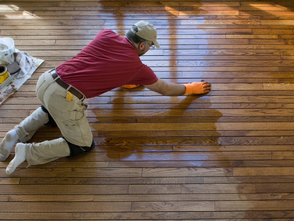 fabulous floors michigan technician refinishing a hardwood floor