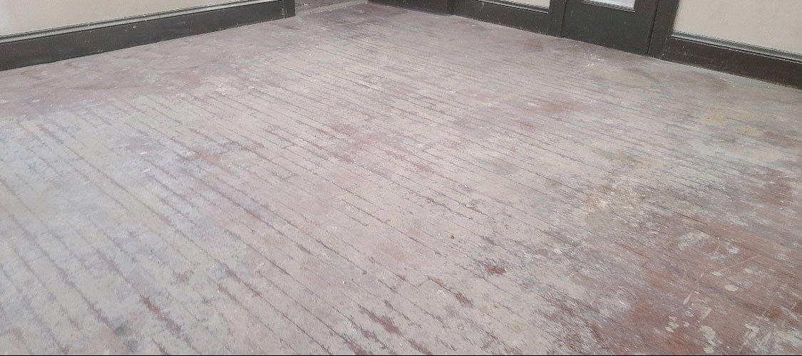 a damaged hardwood floor that needs to be refinished in detroit michigan