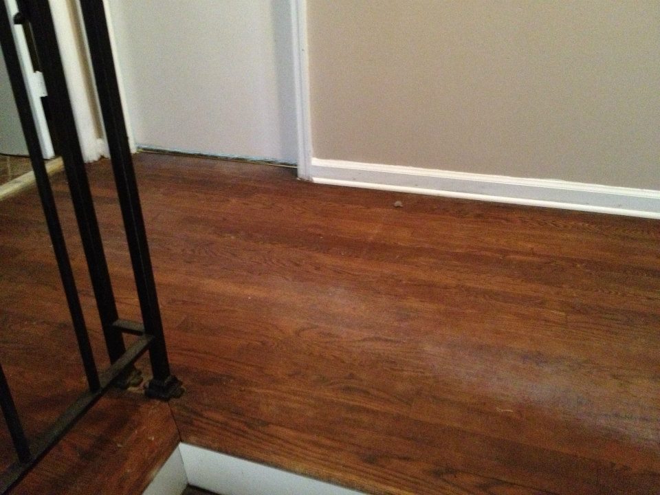 A hardwood floor before being refinished in detroit mi